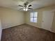 Well-lit bedroom with ceiling fan and window at 5391 Walker Rd, Stone Mountain, GA 30088