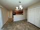 Dining area with tile floors and view of kitchen and backyard at 5391 Walker Rd, Stone Mountain, GA 30088