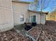 Back exterior view showing patio and landscaping at 5391 Walker Rd, Stone Mountain, GA 30088