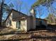 Tan house exterior with sliding glass doors and patio at 5391 Walker Rd, Stone Mountain, GA 30088