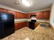 Kitchen boasts granite countertops and dark wood cabinetry at 5391 Walker Rd, Stone Mountain, GA 30088