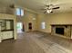 Living room with wet bar, fireplace, and view into the kitchen at 5391 Walker Rd, Stone Mountain, GA 30088