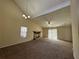 Spacious living room with a fireplace, high ceilings, and sliding glass doors at 5391 Walker Rd, Stone Mountain, GA 30088