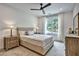 Cozy bedroom featuring a tufted headboard, soft lighting, and neutral tones at 564 Greystone Trce, Marietta, GA 30068