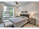 Comfortable bedroom with a large window, plush carpeting, and soft, neutral decor at 564 Greystone Trce, Marietta, GA 30068