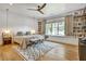 Bright bedroom with a large window, built-in bookshelves, and a ceiling fan at 564 Greystone Trce, Marietta, GA 30068