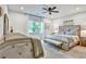 Bright bedroom with a crib, a large window, and a cozy sitting area at 564 Greystone Trce, Marietta, GA 30068
