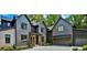 Beautiful exterior elevation of a gray modern home featuring a spacious driveway, manicured landscaping, and attached garage at 564 Greystone Trce, Marietta, GA 30068