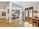 Foyer with wood floors and view to dining room and front door at 564 Greystone Trce, Marietta, GA 30068