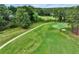 Scenic view of a golf course with lush green fairways and mature trees, offering a serene and picturesque setting at 564 Greystone Trce, Marietta, GA 30068