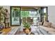 Open living room with fireplace and sliding doors to outdoor patio and dining at 564 Greystone Trce, Marietta, GA 30068
