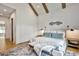 Cozy main bedroom featuring high ceilings with wood beams and neutral color palette at 564 Greystone Trce, Marietta, GA 30068