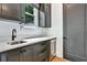 Wet bar with quartz countertop, sink, and beverage cooler at 564 Greystone Trce, Marietta, GA 30068