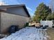 Brick home with backyard and trash cans at 457 Castleaire Dr, Stone Mountain, GA 30087