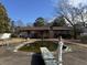 Mature trees surround a kidney-shaped pool with diving board; needs attention at 457 Castleaire Dr, Stone Mountain, GA 30087