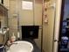 Small bathroom with shower and sink at 457 Castleaire Dr, Stone Mountain, GA 30087