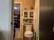 Small bathroom with toilet and sink at 457 Castleaire Dr, Stone Mountain, GA 30087
