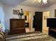 Bedroom with ensuite access, dresser, and ceiling fan at 457 Castleaire Dr, Stone Mountain, GA 30087