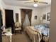 Bedroom with double bed, chair, and window with curtains at 457 Castleaire Dr, Stone Mountain, GA 30087