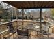 Deck with table and chairs overlooking pool at 457 Castleaire Dr, Stone Mountain, GA 30087