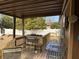 Wooden deck with chairs and small table at 457 Castleaire Dr, Stone Mountain, GA 30087