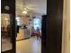 Eat-in kitchen with light wood cabinets, appliances, and a dining table at 457 Castleaire Dr, Stone Mountain, GA 30087