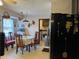 Eat-in kitchen with wood cabinets and a view into laundry area at 457 Castleaire Dr, Stone Mountain, GA 30087