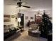 Spacious living room with comfortable seating, a Christmas tree, and large windows at 457 Castleaire Dr, Stone Mountain, GA 30087