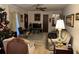 Bright living room with ample seating and a view into dining area at 457 Castleaire Dr, Stone Mountain, GA 30087