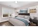 Main bedroom with a king-size bed and stylish decor at 7535 Cordery Rd, Cumming, GA 30040
