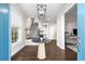 Bright entryway with hardwood floors, a round table, and stairs at 7535 Cordery Rd, Cumming, GA 30040