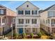 Two-story home with white siding, black shutters, and a front porch at 7535 Cordery Rd, Cumming, GA 30040