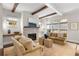Spacious living room with a stone fireplace and comfy seating at 7535 Cordery Rd, Cumming, GA 30040