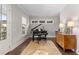 Bright music room with grand piano and hardwood floors at 7535 Cordery Rd, Cumming, GA 30040