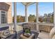 Relaxing screened porch with comfortable seating at 7535 Cordery Rd, Cumming, GA 30040