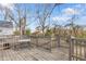 Wooden deck with table, steps, and backyard view at 1087 Longley Nw Ave, Atlanta, GA 30318