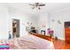 Cozy bedroom with hardwood floors, a wooden bed frame, and a view of the kitchen at 1091 Longley Nw Ave, Atlanta, GA 30318