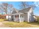 Gray craftsman style home with a red front door and side yard at 1091 Longley Nw Ave, Atlanta, GA 30318