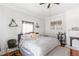 Main bedroom with hardwood floors, a king-size bed, and a fireplace at 1091 Longley Nw Ave, Atlanta, GA 30318