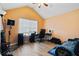 Bedroom with vaulted ceiling, workspace, and hardwood floors at 6684 Crane Ave, Fairburn, GA 30213