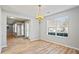 Spacious dining room with hardwood floors and chandelier at 6684 Crane Ave, Fairburn, GA 30213