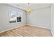 Dining room with hardwood floors, chandelier and window at 6684 Crane Ave, Fairburn, GA 30213