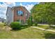 Brick and siding two-story house with a landscaped lawn at 6684 Crane Ave, Fairburn, GA 30213