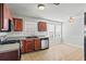 Kitchen with wood cabinets, granite counters and appliances at 6684 Crane Ave, Fairburn, GA 30213