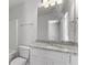 Clean bathroom with granite countertop and mirror at 7256 Crestside Dr, Austell, GA 30168