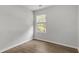 Simple bedroom with hardwood floors and a window at 7256 Crestside Dr, Austell, GA 30168