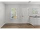 Dining area with hardwood floors and white door at 7264 Crestside Dr, Austell, GA 30168