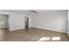 Spacious living room with hardwood floors and ceiling fan at 7264 Crestside Dr, Austell, GA 30168