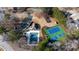 Community pool, tennis courts, and playground are featured in this aerial view at 9165 Golfview Ln, Covington, GA 30014