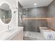 Modern bathroom with a large walk-in shower and soaking tub at 9165 Golfview Ln, Covington, GA 30014